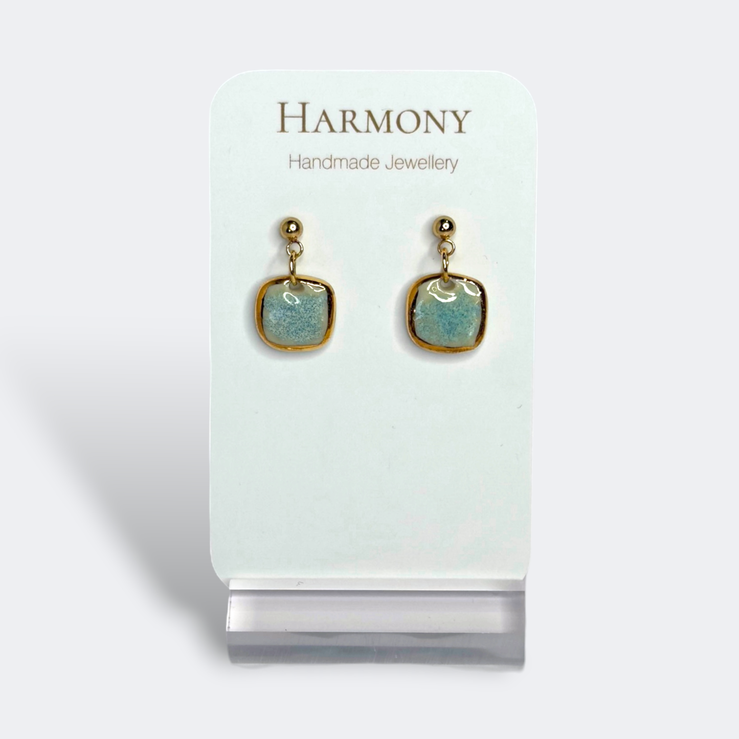 Blue-green ceramic earrings with gold rim, handmade by Harmony Pottery Melbourne
