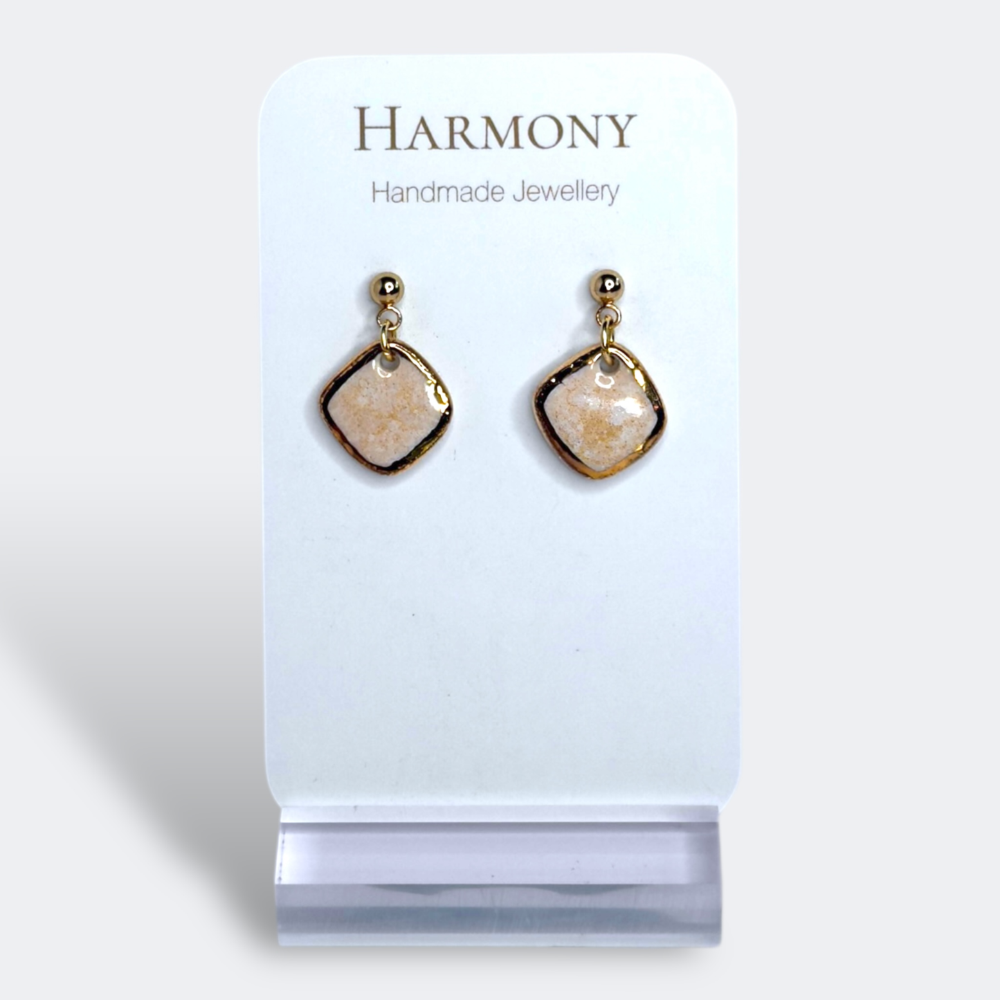 Blush Pink ceramic earrings with gold rim, handmade by Harmony Pottery Melbourne