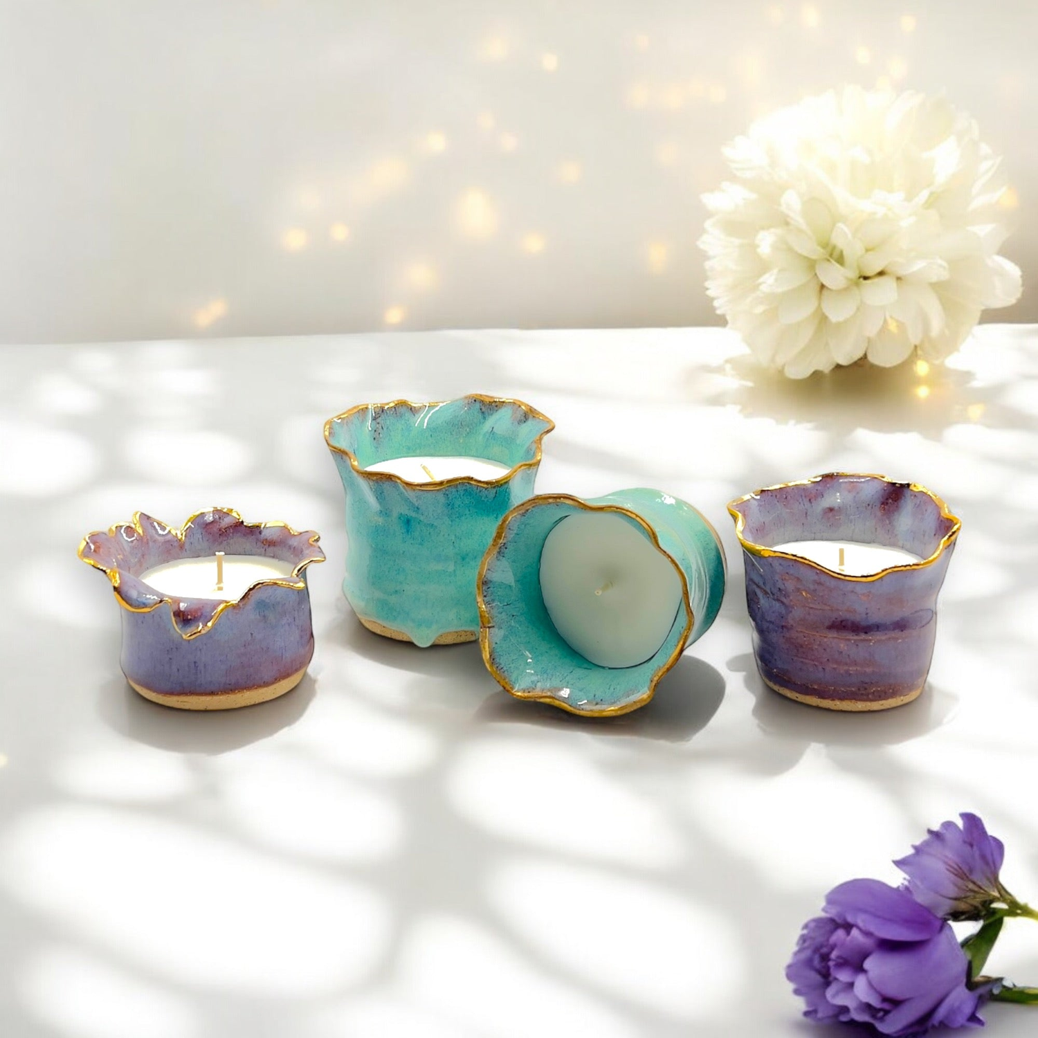 Handmade ceramic soy candles in aqua green and lavender mist jars with 24k gold rim – Melbourne artisan pottery candle collection.