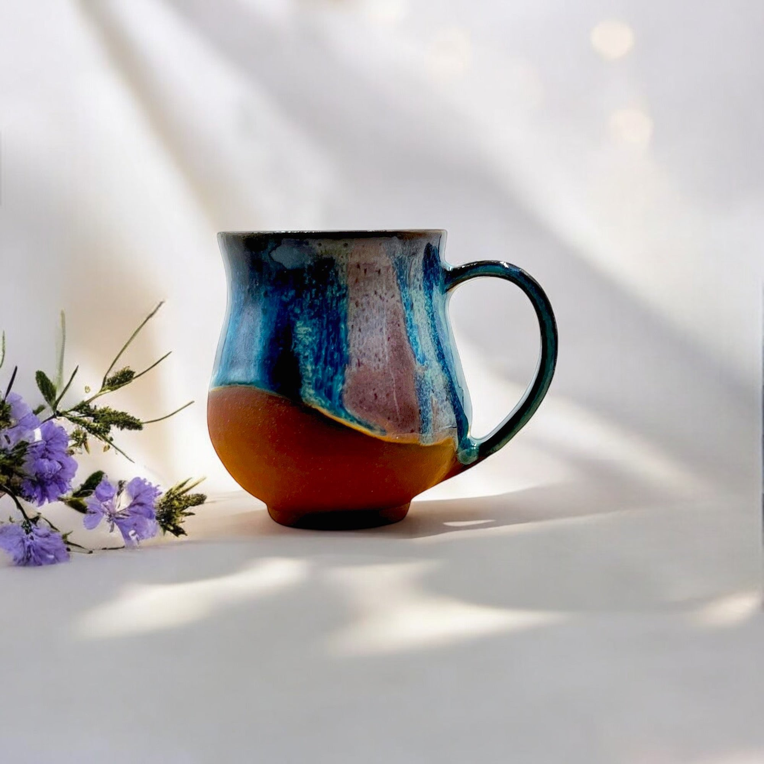 Handmade ceramic coffee mugs with layered glazes crafted in Melbourne Australia