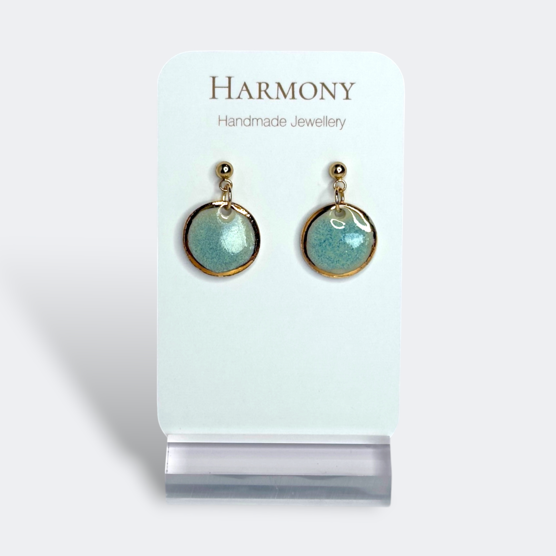 Blue-green ceramic earrings with gold rim, handmade by Harmony Pottery Melbourne