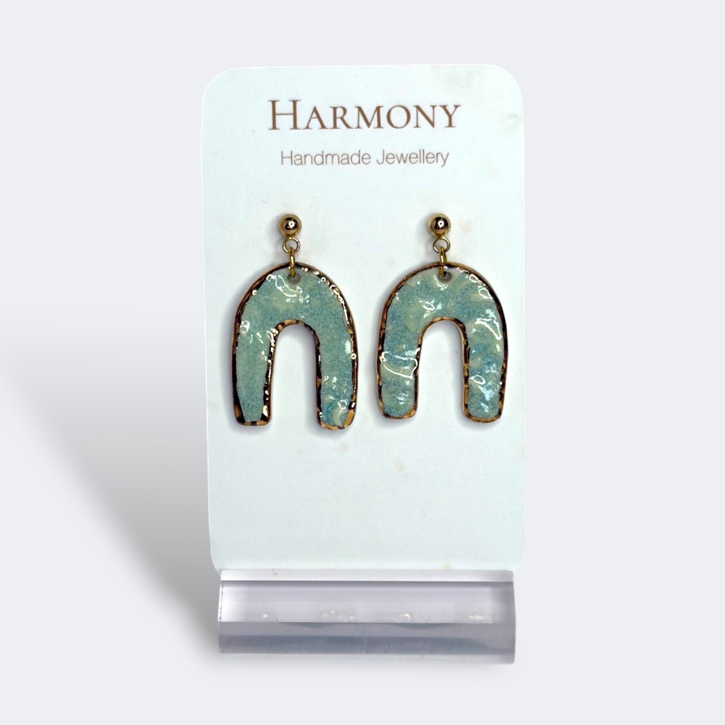 Blue-green ceramic earrings with gold rim, handmade by Harmony Pottery Melbourne