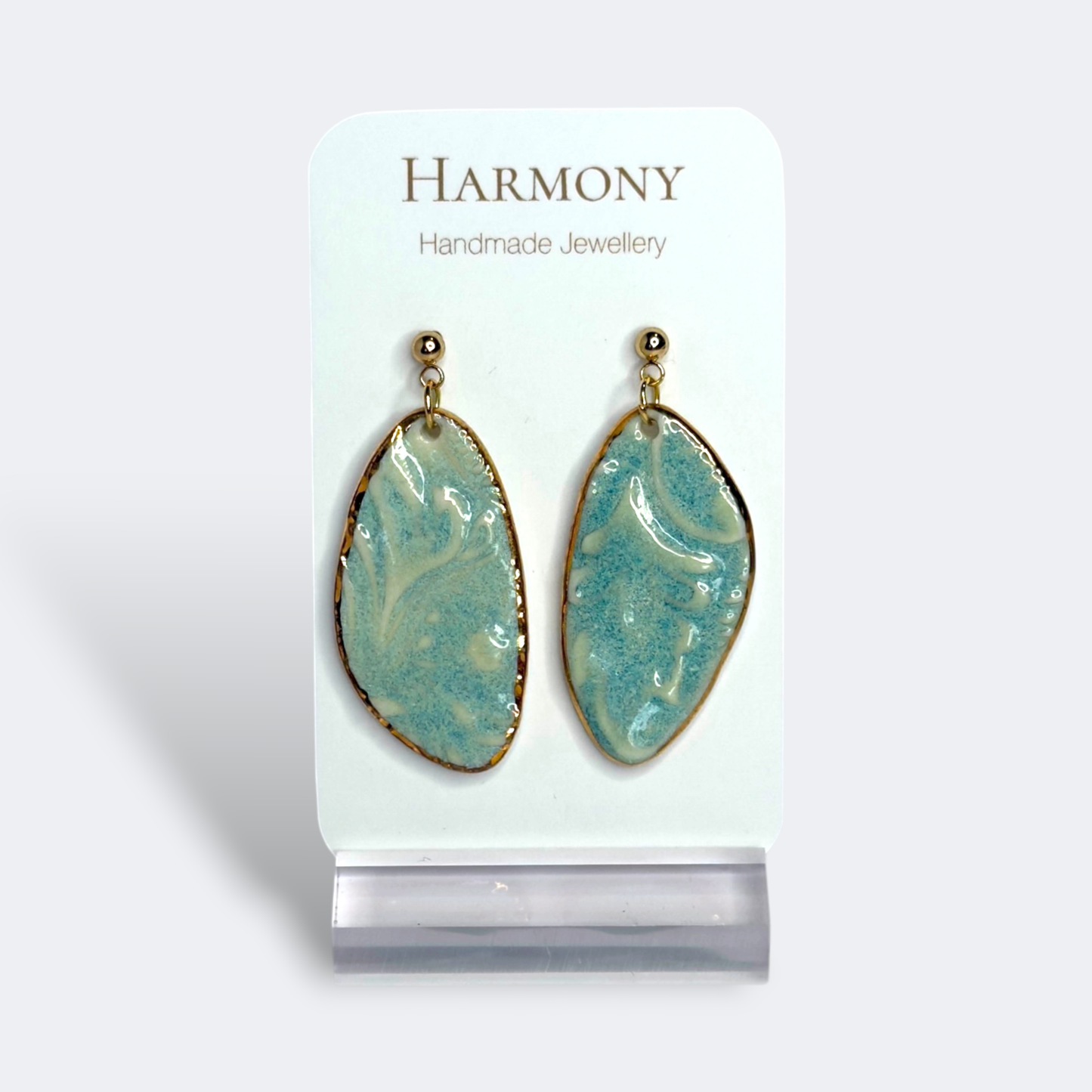 Blue-green ceramic earrings with gold rim, handmade by Harmony Pottery Melbourne