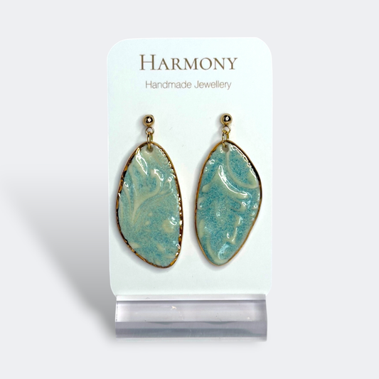 Blue-green ceramic earrings with gold rim, handmade by Harmony Pottery Melbourne
