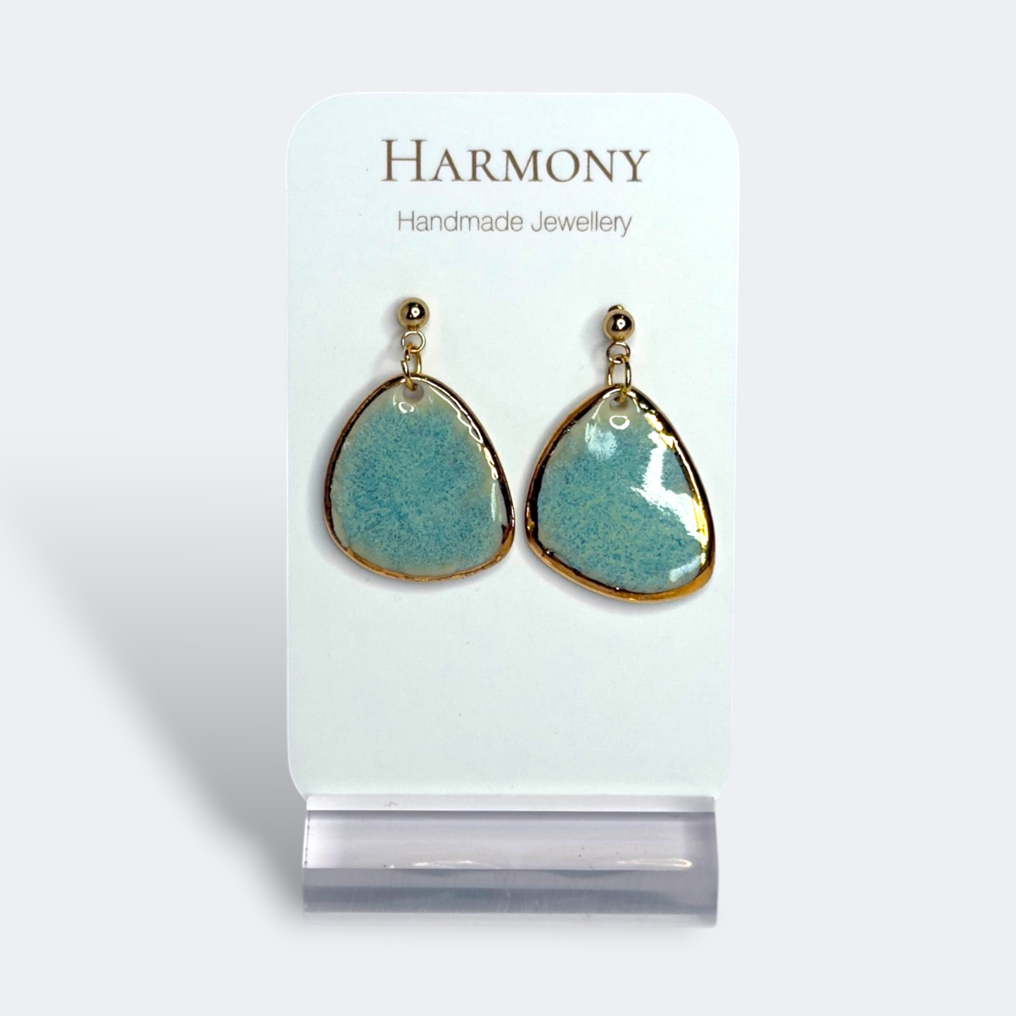 Blue-green ceramic earrings with gold rim, handmade by Harmony Pottery Melbourne