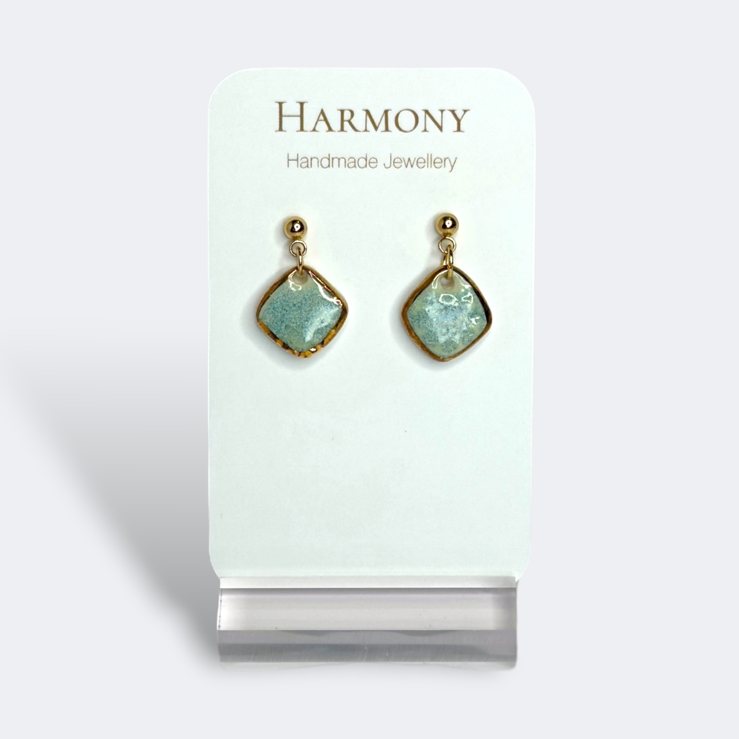 Blue-green ceramic earrings with gold rim, handmade by Harmony Pottery Melbourne