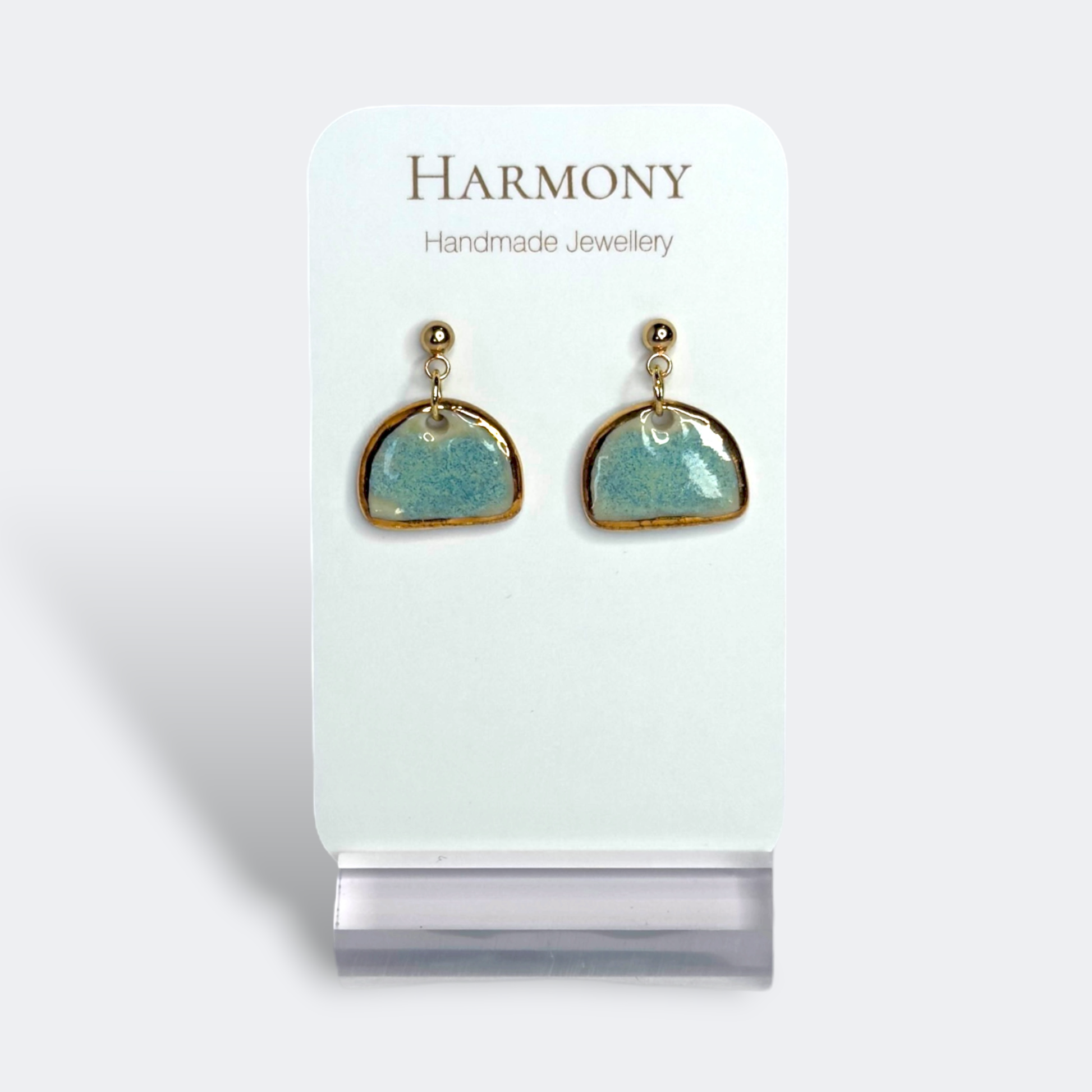 Blue-green ceramic earrings with gold rim, handmade by Harmony Pottery Melbourne