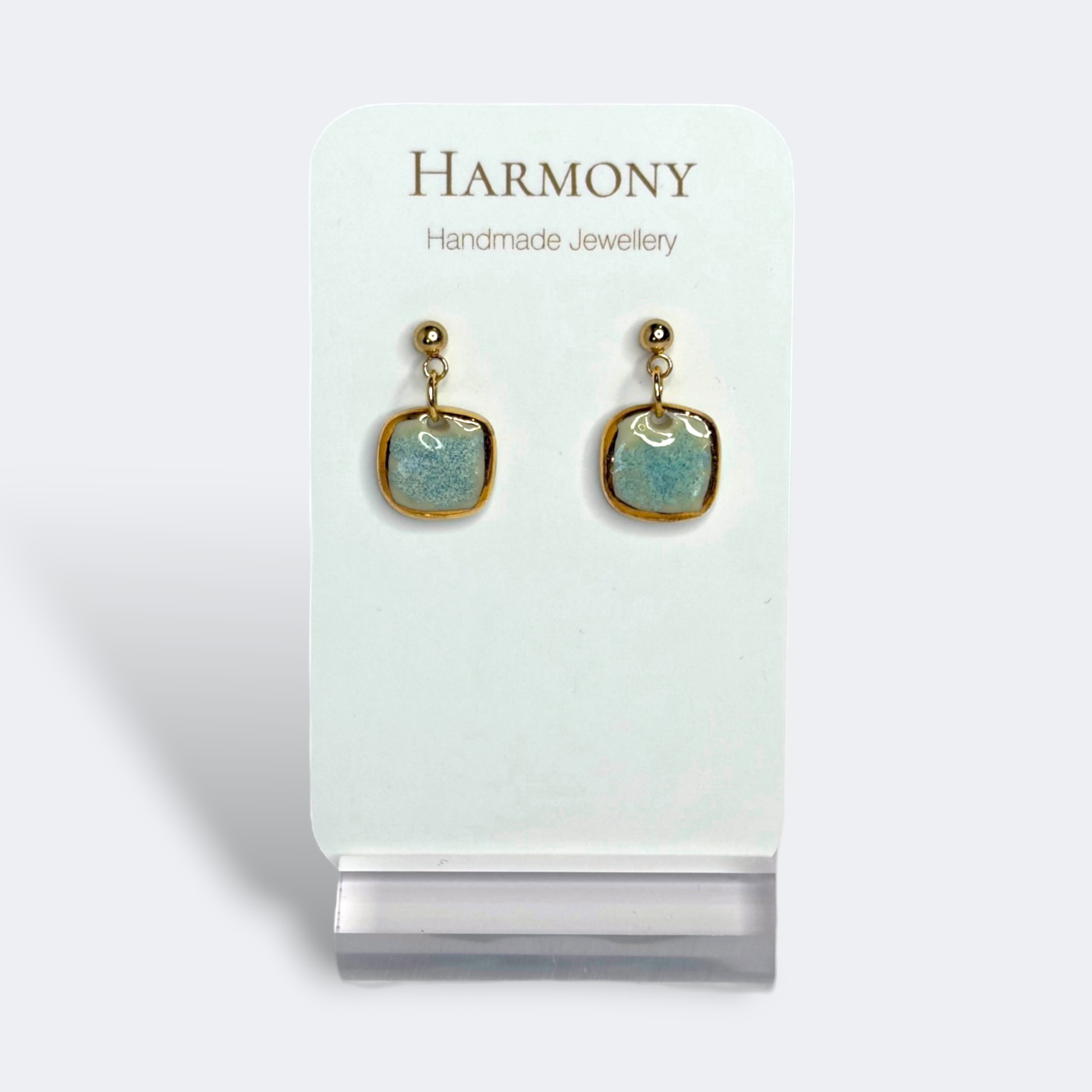Blue-green ceramic earrings with gold rim, handmade by Harmony Pottery Melbourne